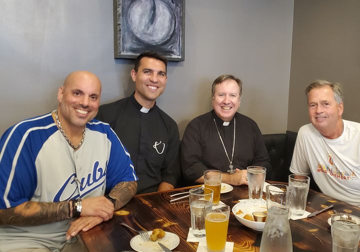 Chris Pavlou with community guests at a Pavlou Restaurant Group table in Northwest Indiana